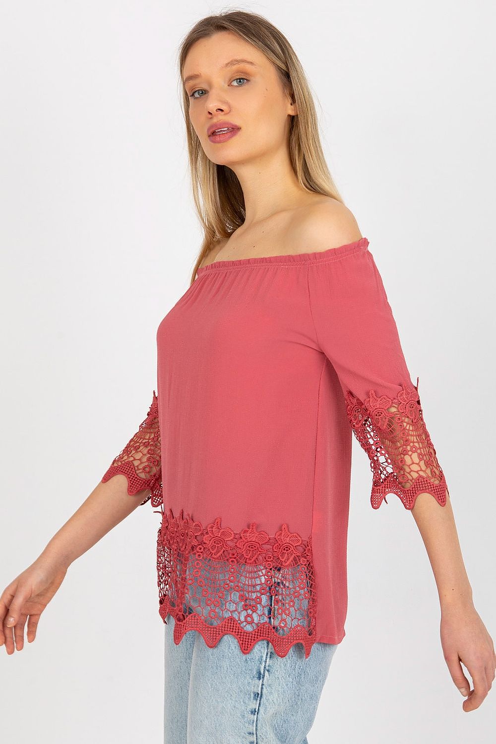 Fashionable Lakerta blouse accentuating a graceful figure, featuring a luxurious coral tone and exquisite lace details, perfect for upscale occasions.