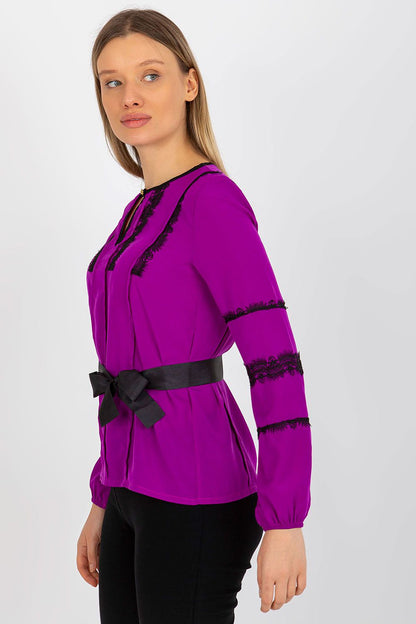 Side view of Lakerta long sleeve blouse in rich purple, featuring elegant lace accents and a chic tie belt for women.