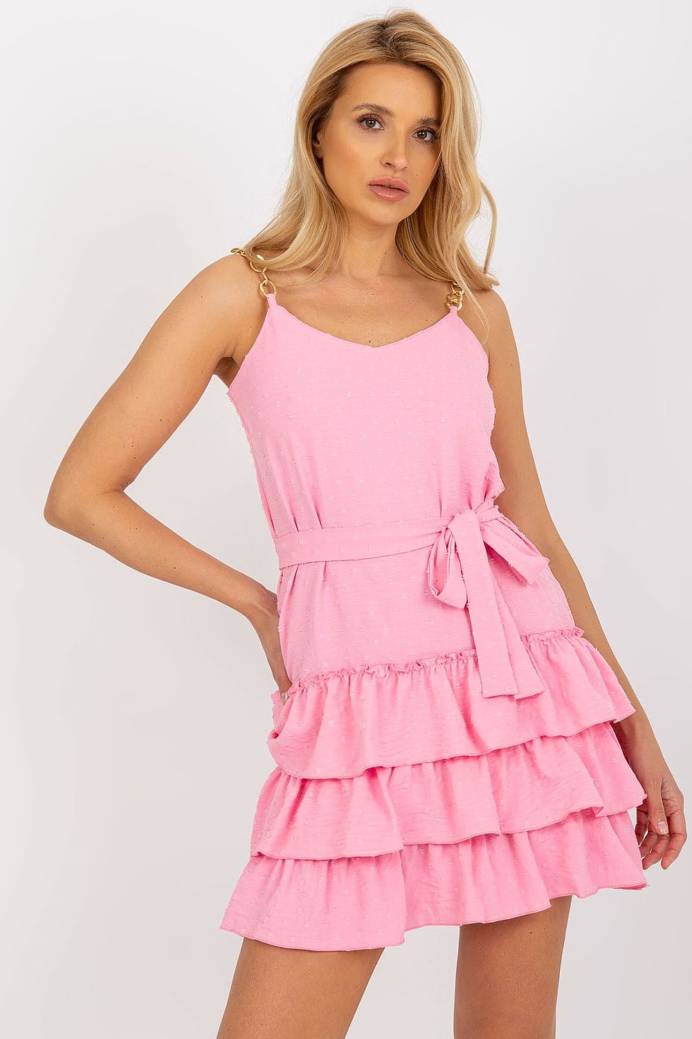 Sophisticated front view of a luxury pink mini dress with chain straps and a waist tie by Lakerta, highlighting its stylish frill detail.