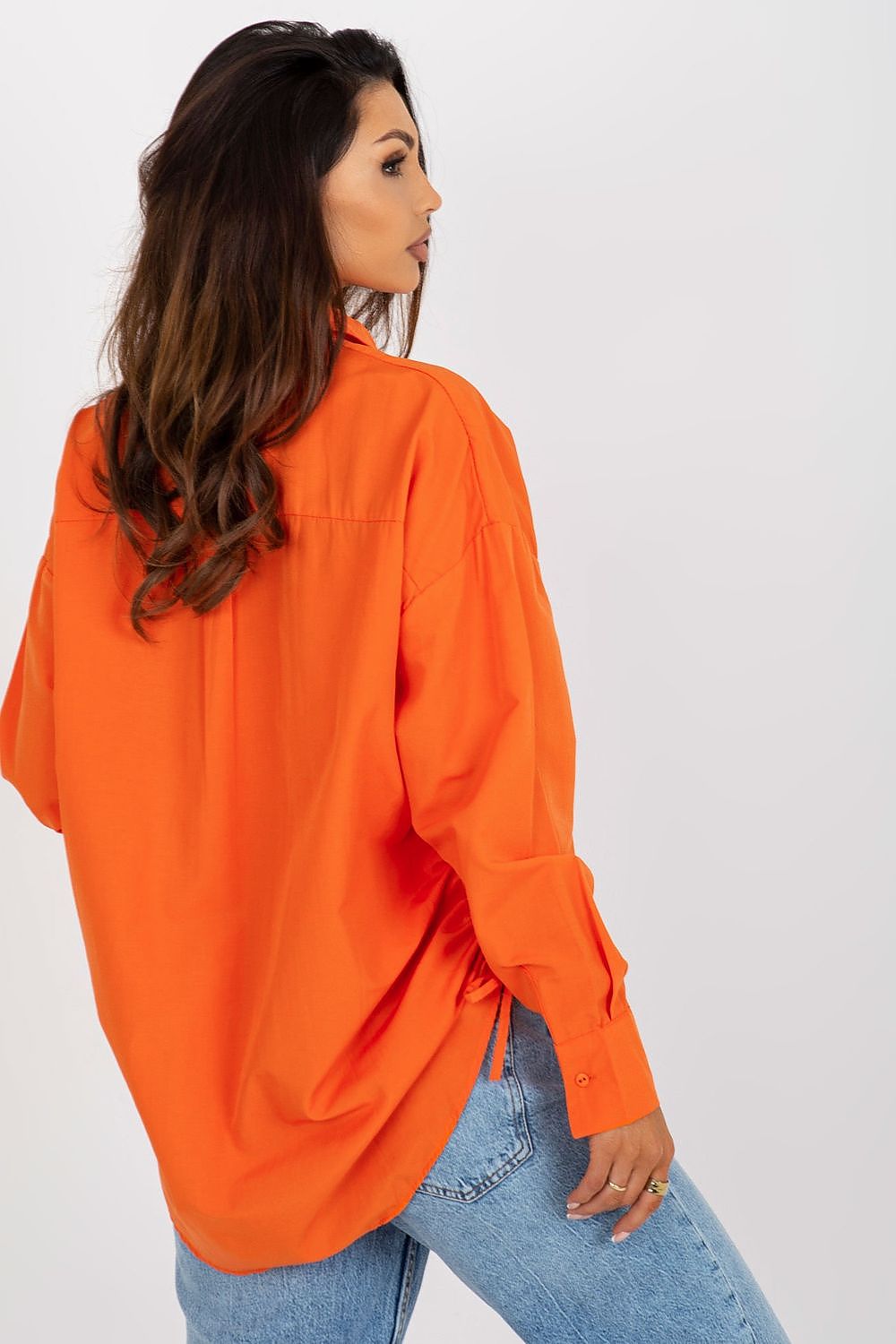 Trendy orange long sleeve shirt for women with refined styling and gathered side ties, designed by Factory Price.