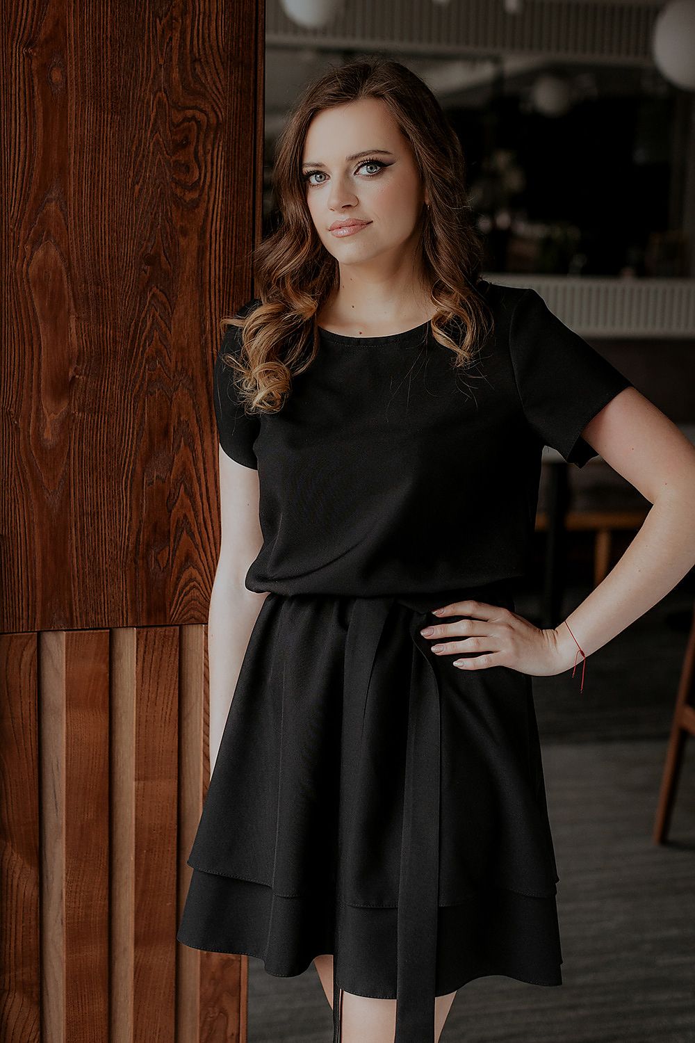 Detail shot of the elegant Tessita dress showing the fine stitching and luxurious blend of polyester and spandex for comfort and style.