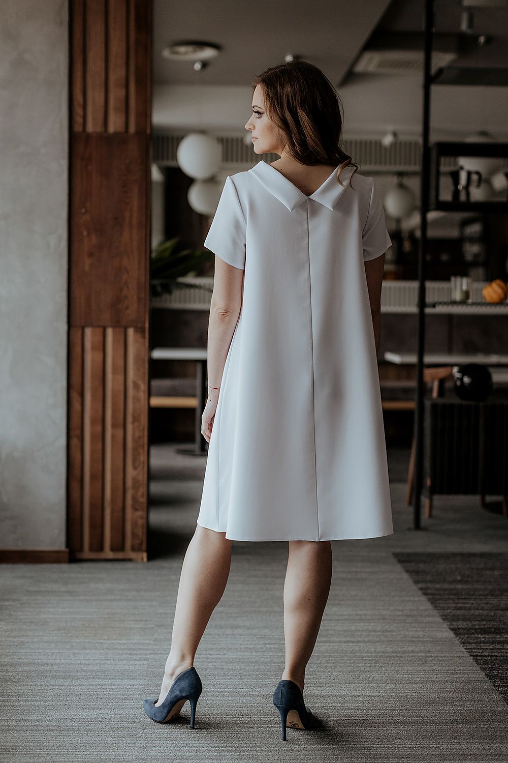 Model wearing Tessita's classy loose-fitting daydress, perfectly styled for an elegant day out or special event.