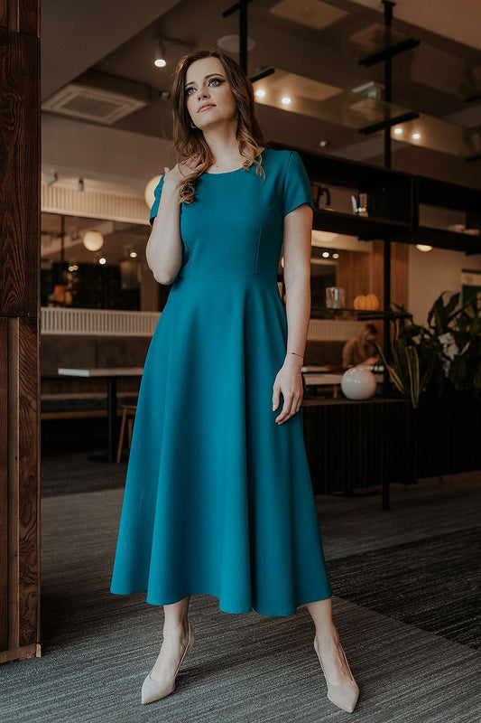 Elegant flared long dress with short sleeves and covered zipper by Tessita, perfect for any occasion, showcasing luxurious style and comfort.