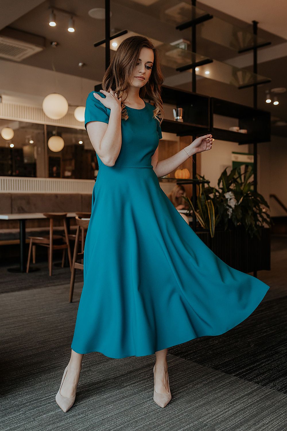 Elegant flared long dress by Tessita, featuring short sleeves and a stylish covered zipper, perfect for luxurious occasions.