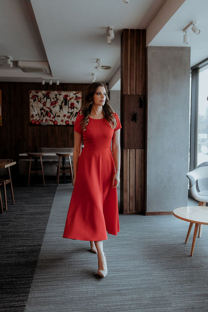 Back view of the Tessita flared long dress with covered zipper, exemplifying sophistication and grace for evening wear.