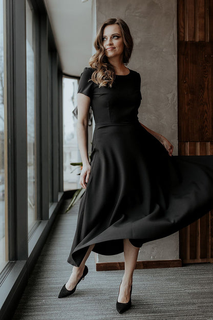 Fashionable flat lay of the Tessita flared long dress with short sleeves, perfect for fashion enthusiasts seeking elegance.