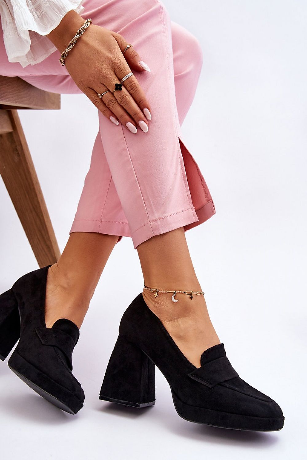 Luxury black eco-suede heel pumps by Step In Style, featuring a block heel and elegant design, paired with stylish pink trousers for a chic look.