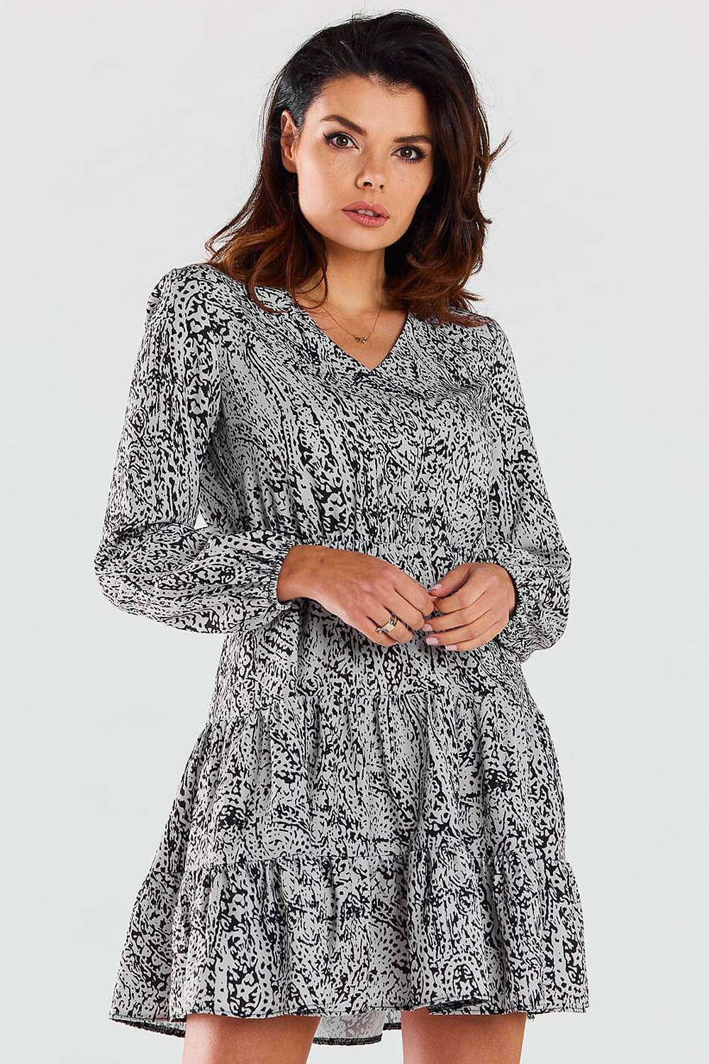 Elegant Awama mini dress with long sleeves and V neckline, featuring charming frills.