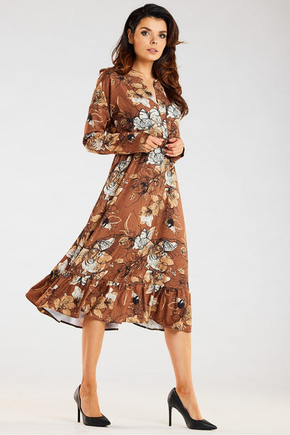 Elegant Awama midi dress with floral print and flared frill hem, capturing a luxurious style stance, designed for fashionable women.