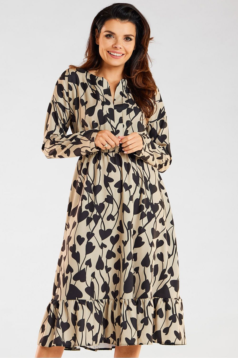 Chic Midi Dress by Awama, adorned with an artistic heart pattern against a beige background, designed with long sleeves and a flowing frill hem for an upscale casual appearance.