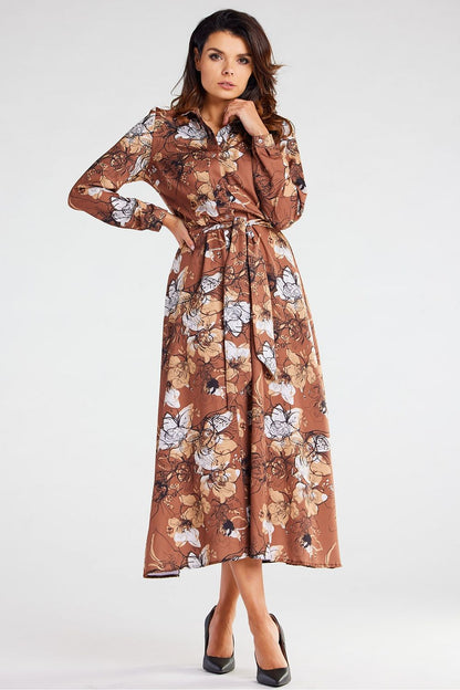 Chic Awama maxi dress with a flattering silhouette and long sleeves, designed with a beautiful floral motif, perfect for formal gatherings.