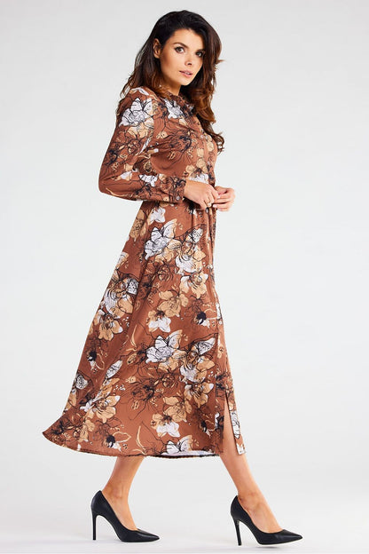 Graceful Awama maxi dress featuring a belted waist and flowing design, accentuated by exquisite floral details, ideal for a luxurious ensemble.