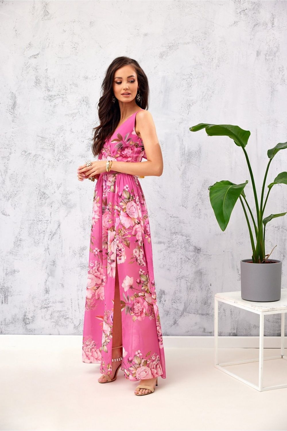 Stylish pink floral chiffon maxi dress by Roco Fashion, showcasing a flattering leg slit and sophisticated envelope neckline, ideal for upscale events.