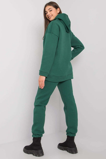 Back view of a fashionable woman in a BFG cotton-blend hoodie and matching pants, presenting a sophisticated look in deep green.
