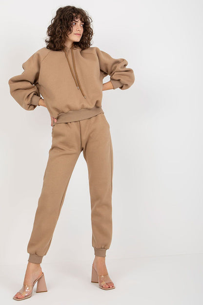ElegantEx Moda Premium Cotton-Blend Sweatshirt Set showcasing a model in a luxurious beige sweatshirt and long pants with a hood, exuding modern sophistication.