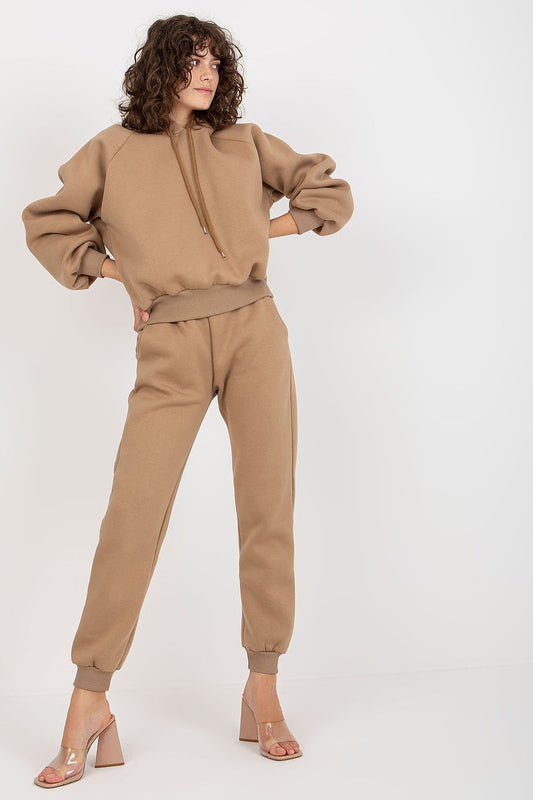 ElegantEx Moda Premium Cotton-Blend Sweatshirt Set showcasing a model in a luxurious beige sweatshirt and long pants with a hood, exuding modern sophistication.