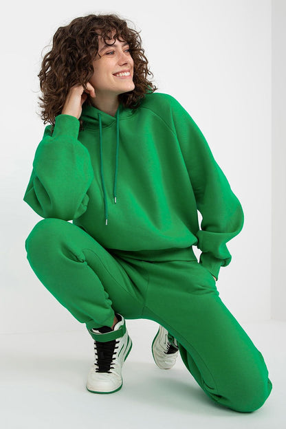Casual pose of a model wearing Ex Moda's green cotton-blend sweatshirt set, exuding comfort and style; ideal for modern wardrobes.