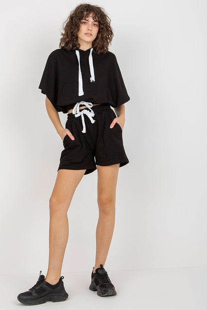 Fashionable black tracksuit set from Ex Moda, showcasing a stylish oversized hoodie and tailored shorts, combining comfort with luxury.
