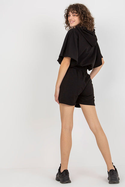 Sophisticated black tracksuit set by Ex Moda featuring a hoodie and tie waist shorts, offering a sleek silhouette and modern elegance.