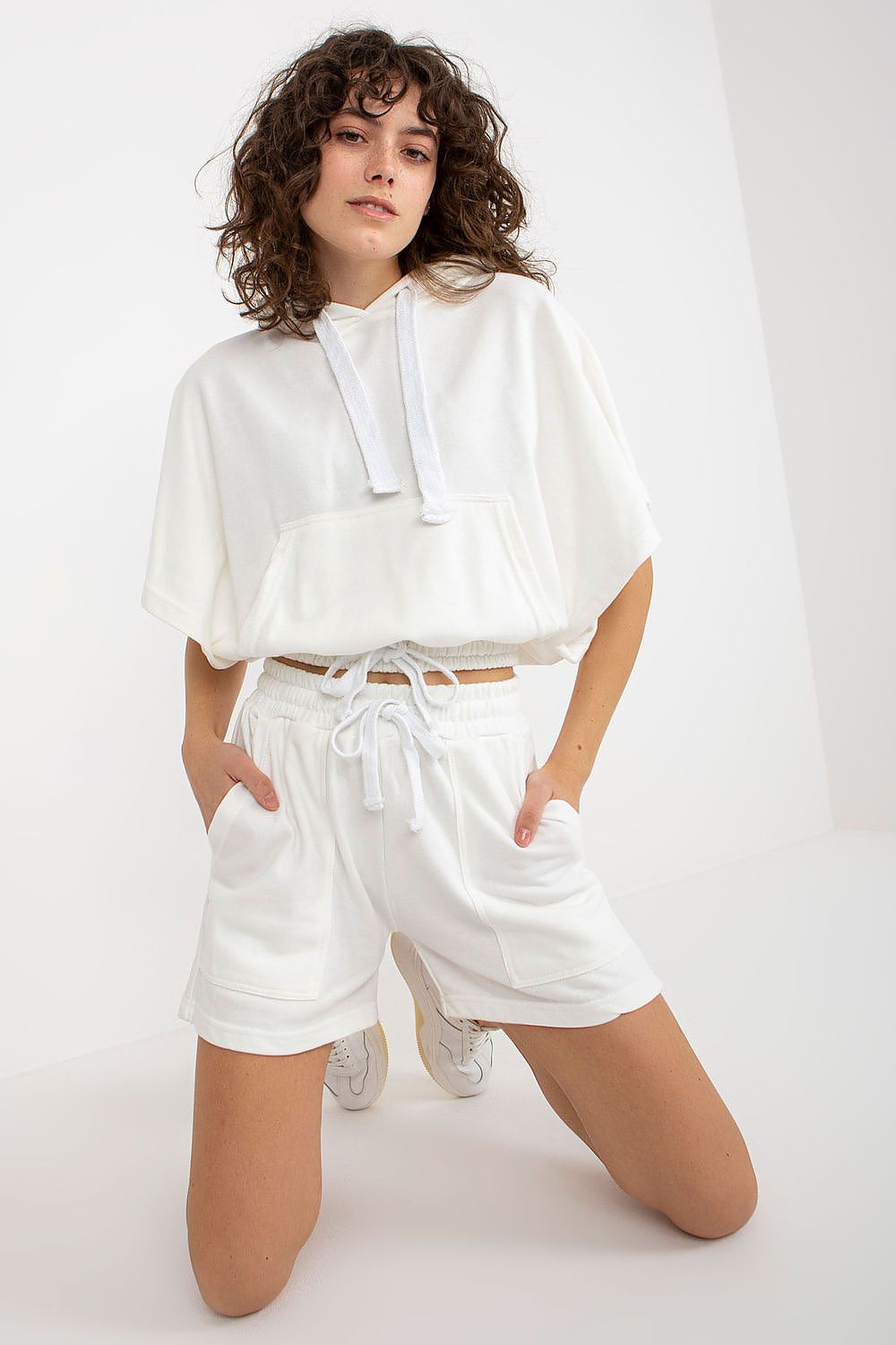 Pure white luxury tracksuit set by Ex Moda, consisting of a cosy hoodie and chic shorts, perfect for elevated casual outfits.