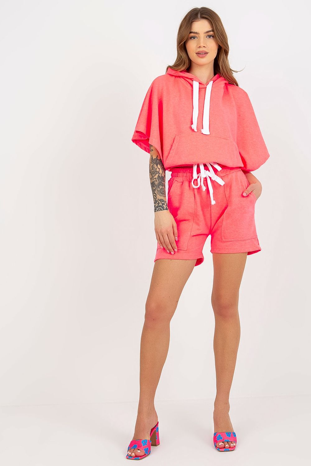 Dazzling front view of the Luxury Ex Moda Tracksuit Set in bright pink, featuring a chic hooded blouse and matching shorts, perfect for a trendy casual outfit.