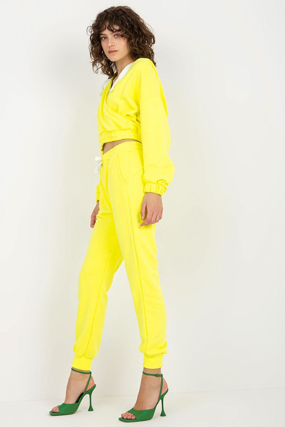 Ex Moda luxury cotton sweatshirt set in bright yellow, showcasing a relaxed silhouette with a hood, complemented by flattering tie waist trousers.