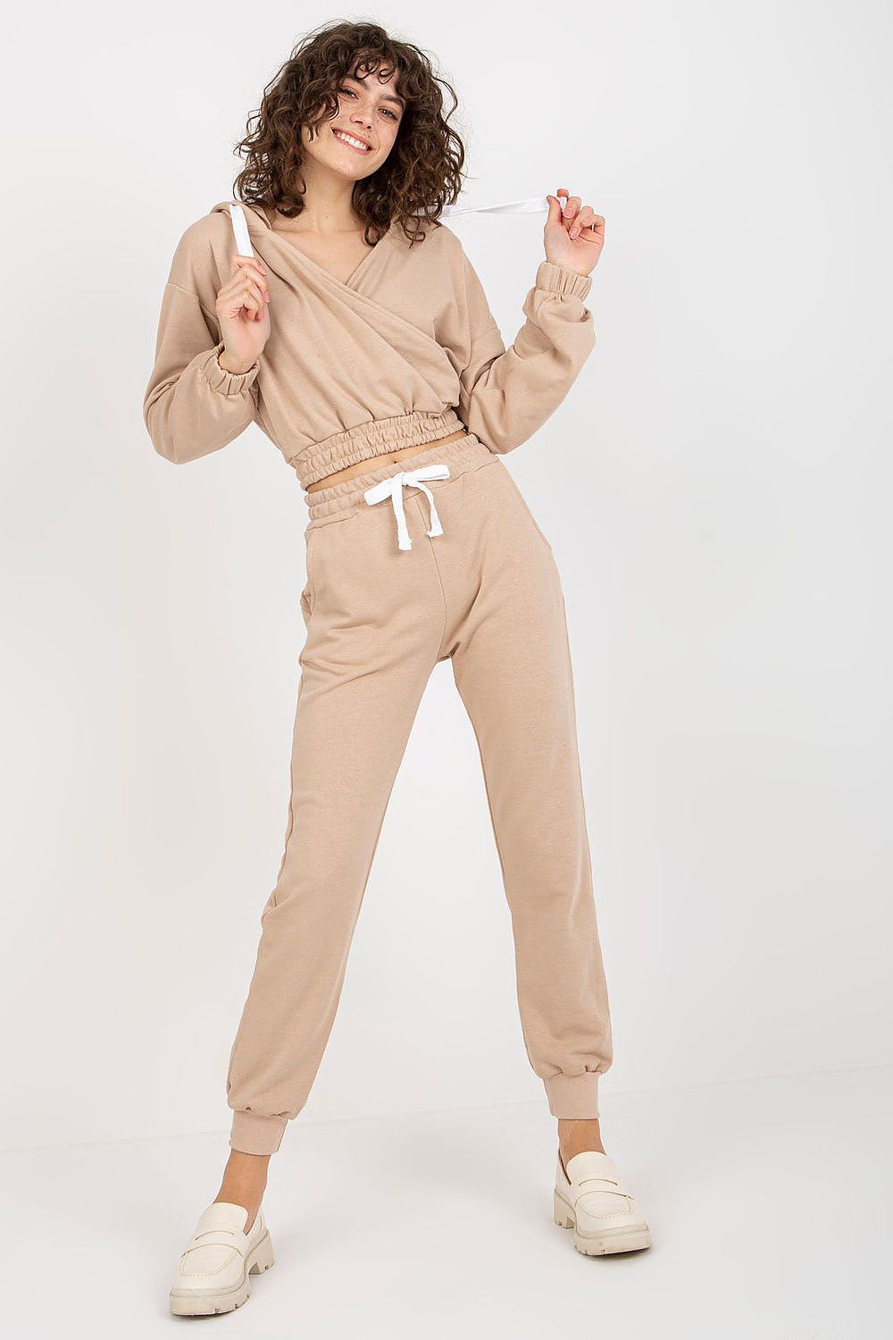Ex Moda luxury cotton blend loungewear set in soft beige, featuring a chic hooded sweatshirt and stylish jogger pants with a drawstring.