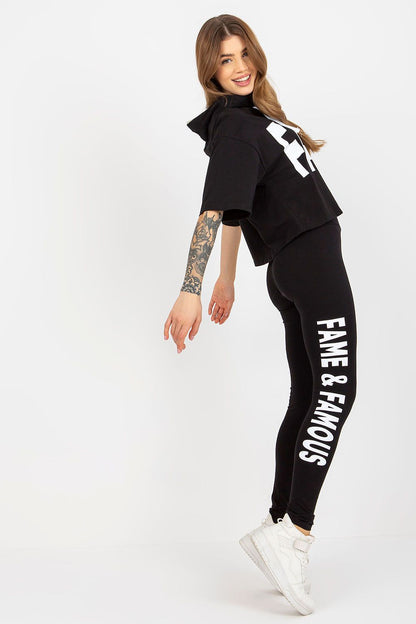 Ex Moda luxury women's cotton sweatshirt and leggings set featuring a loose cut black hoodie with the inscription 'FAME' and black leggings adorned with 'FAME & FAMOUS'. Perfect for stylish casual wear.