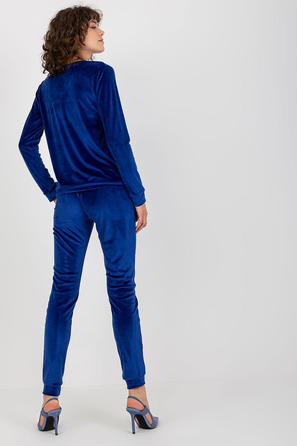 Stylish velour tracksuit set by Relevance in vibrant blue, featuring a comfortable sweatshirt and flattering long pants, perfect for casual luxury.