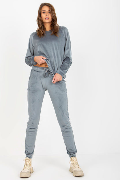 Relevance elegant velour set featuring a stylish blouse with rhinestone sleeves and matching long pants, showcased in a sophisticated grey hue.