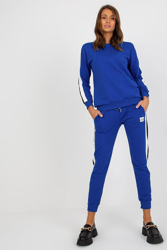 Luxurious blue cotton-spandex sweatshirt set by Relevance featuring two-tone stripes, paired with elegantly tailored tie-waist pants. Model showcasing a stylish look with long sleeves and comfortable slip pockets.