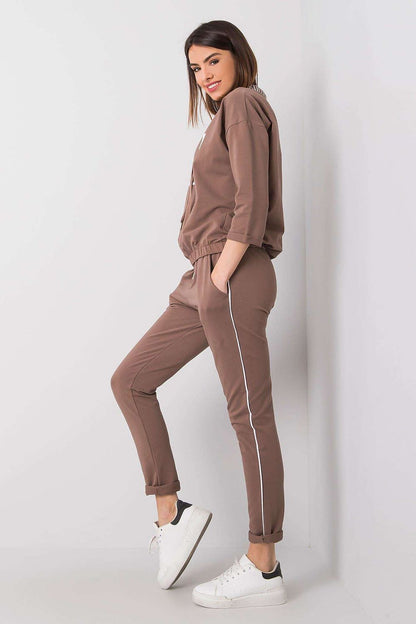 Luxurious women's tracksuit set featuring a 3/4 sleeve sweatshirt and long pants in a chic brown hue, styled by Relevance.