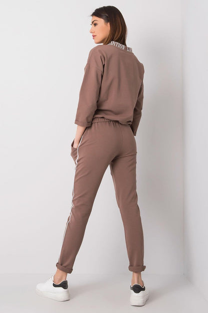 Elegant back view of a women's tracksuit set showcasing a 3/4 sleeve sweatshirt and tailored long pants, designed by Relevance.