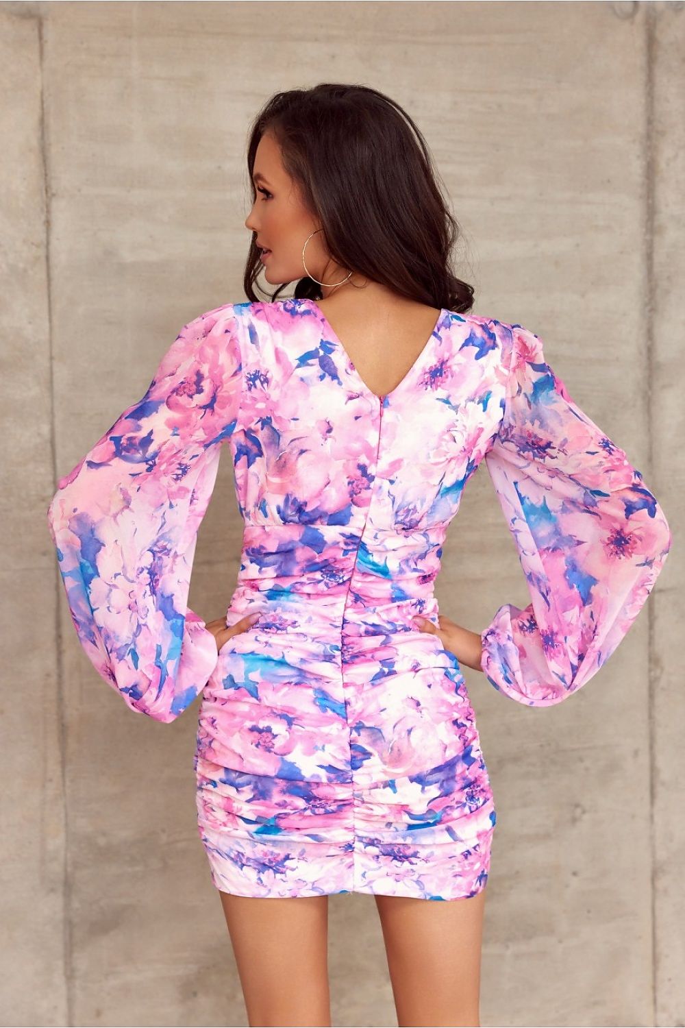 Elegant back view of the Chic Roco Fashion cocktail dress featuring a V-neckline, floral print, and draped skirt, complemented by stylish long puffed sleeves.