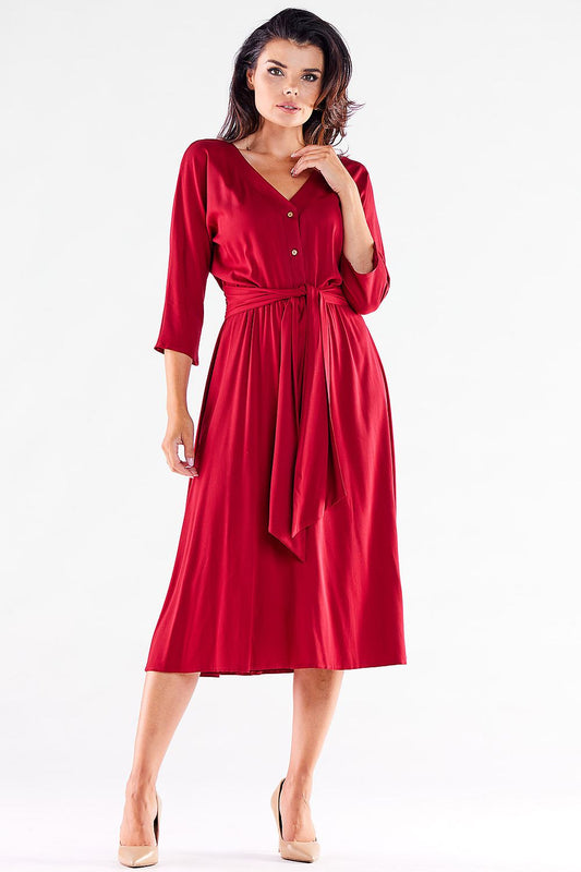 Front view of a luxurious red midi dress with a belt by awama, featuring a buttoned design and flattering silhouette.