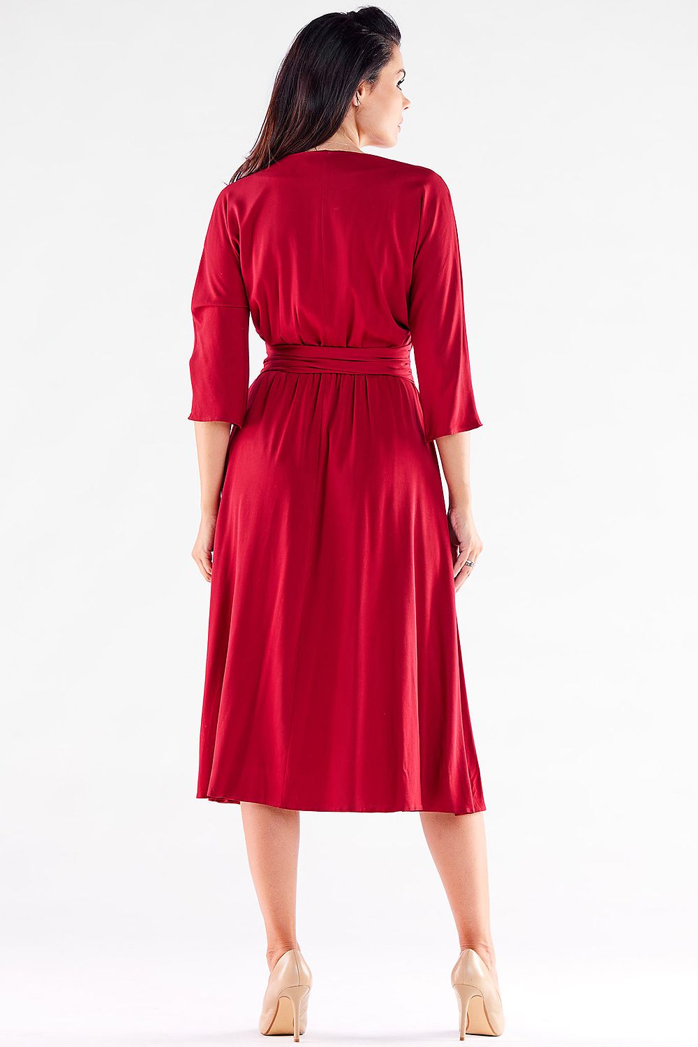 Back view of an exquisite red midi dress by awama, showcasing its elegant belt and flowing trapezoidal design.