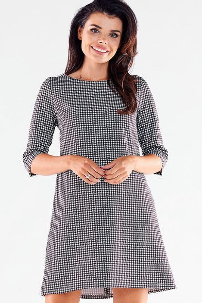 Sophisticated houndstooth mini daydress with 3/4 sleeves from awama, exuding luxury and style with a modern twist.