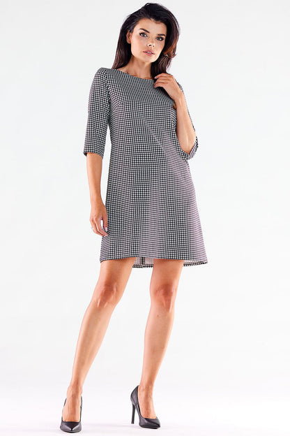 Fashionable front view of an elegant houndstooth printed mini daydress with 3/4 sleeves by awama, perfect for any occasion.