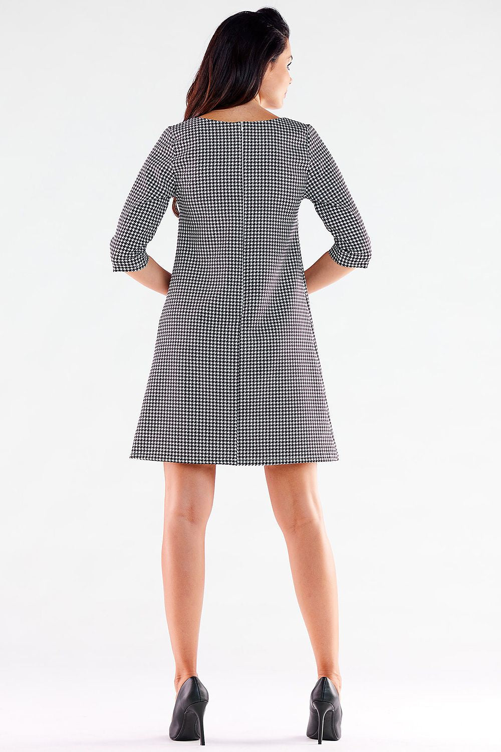 Stylish back view of a houndstooth mini daydress with 3/4 sleeves by awama, featuring a flattering trapezoidal cut and elegant design.