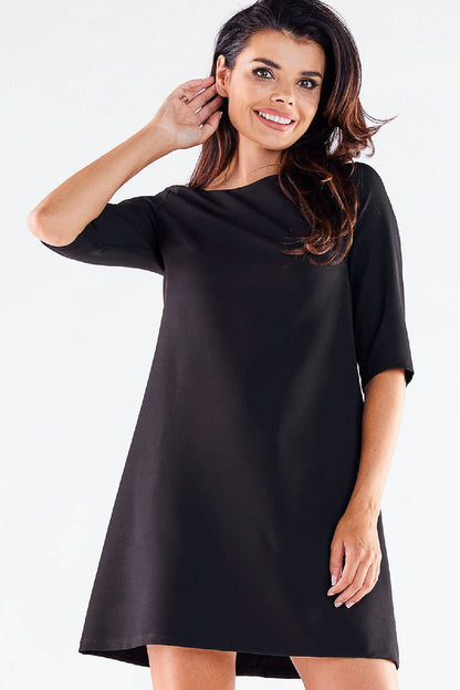 Elegant mini daydress by awama, featuring 3/4 sleeves and a modern trapezoidal cut, perfect for sophisticated casual occasions.
