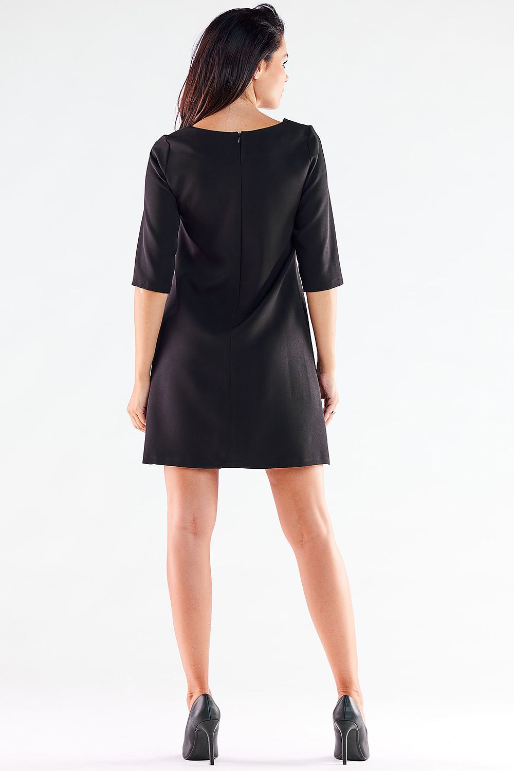 Rear view of an elegant mini daydress by awama, highlighting the covered zipper closure and refined trapezoidal design.