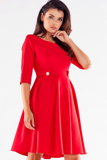 Elegant model showcasing the Blushed Awama Daydress with decorative buttons, featuring a flattering silhouette, designed for sophistication and comfort, perfect for any occasion.
