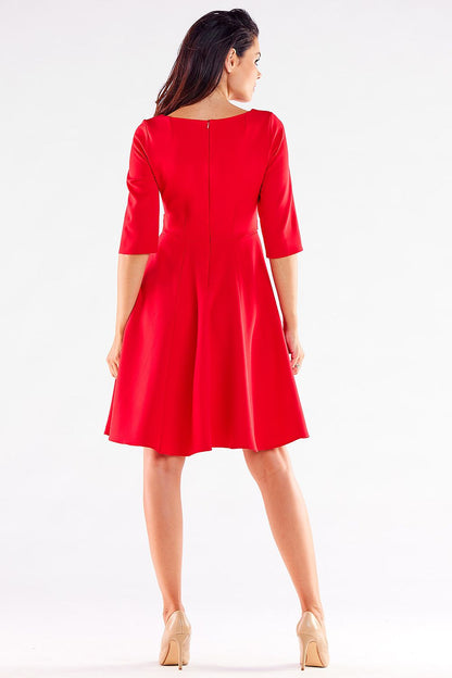 Elegant blushed Awama daydress featuring a flattering silhouette and decorative buttons, designed for a sophisticated look.