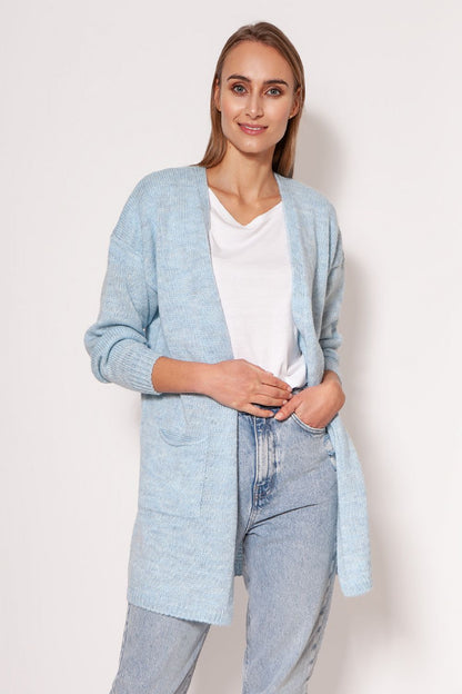 MKM luxury melange knit cardigan in soft blue, featuring dropped shoulders and hip pockets, photographed on a model wearing casual attire.