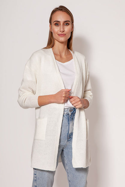 Elegant MKM melange knit cardigan in pristine white, designed with dropped shoulders and hip pockets, showcased on a model with a minimalist look.