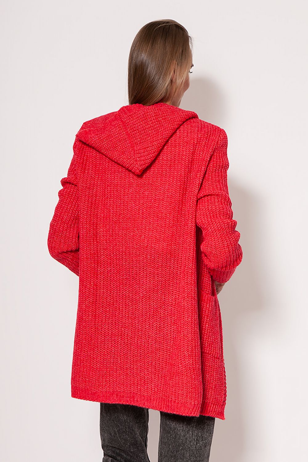 Back view of the MKM luxurious soft cardigan coat in bright red, featuring a stylish hood and a seamless minimalist cut, presented by a model demonstrating its elegant fit.