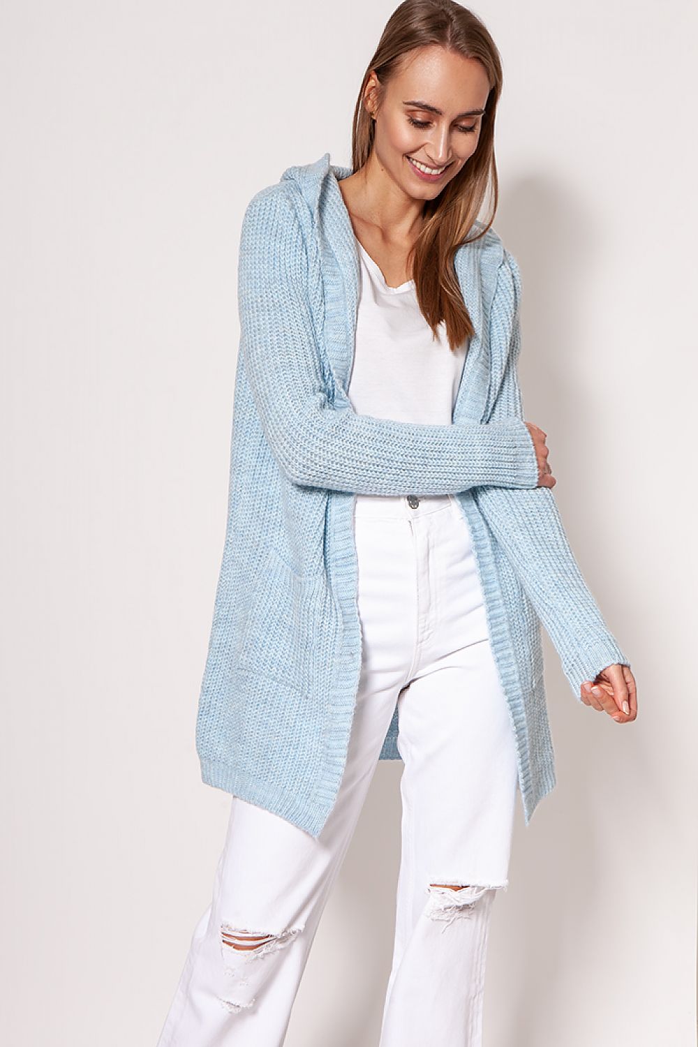 MKM luxurious soft cardigan coat in light blue, featuring a minimalist design with hip pockets, styled with white top and jeans, exuding elegance.