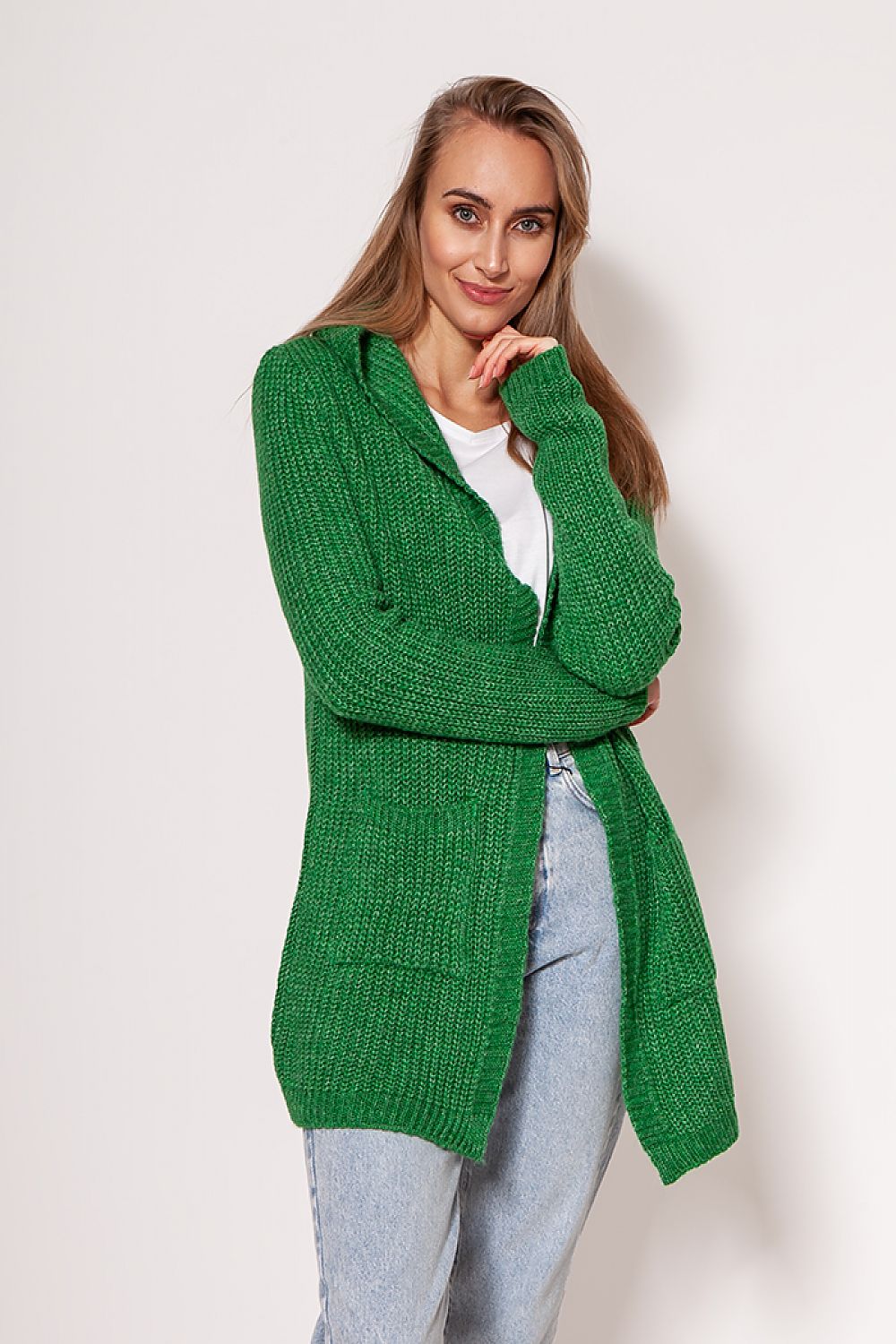Front view of a vibrant green MKM cardigan coat showcasing a minimalist aesthetic, designed with spacious hip pockets and a casual yet elegant vibe.
