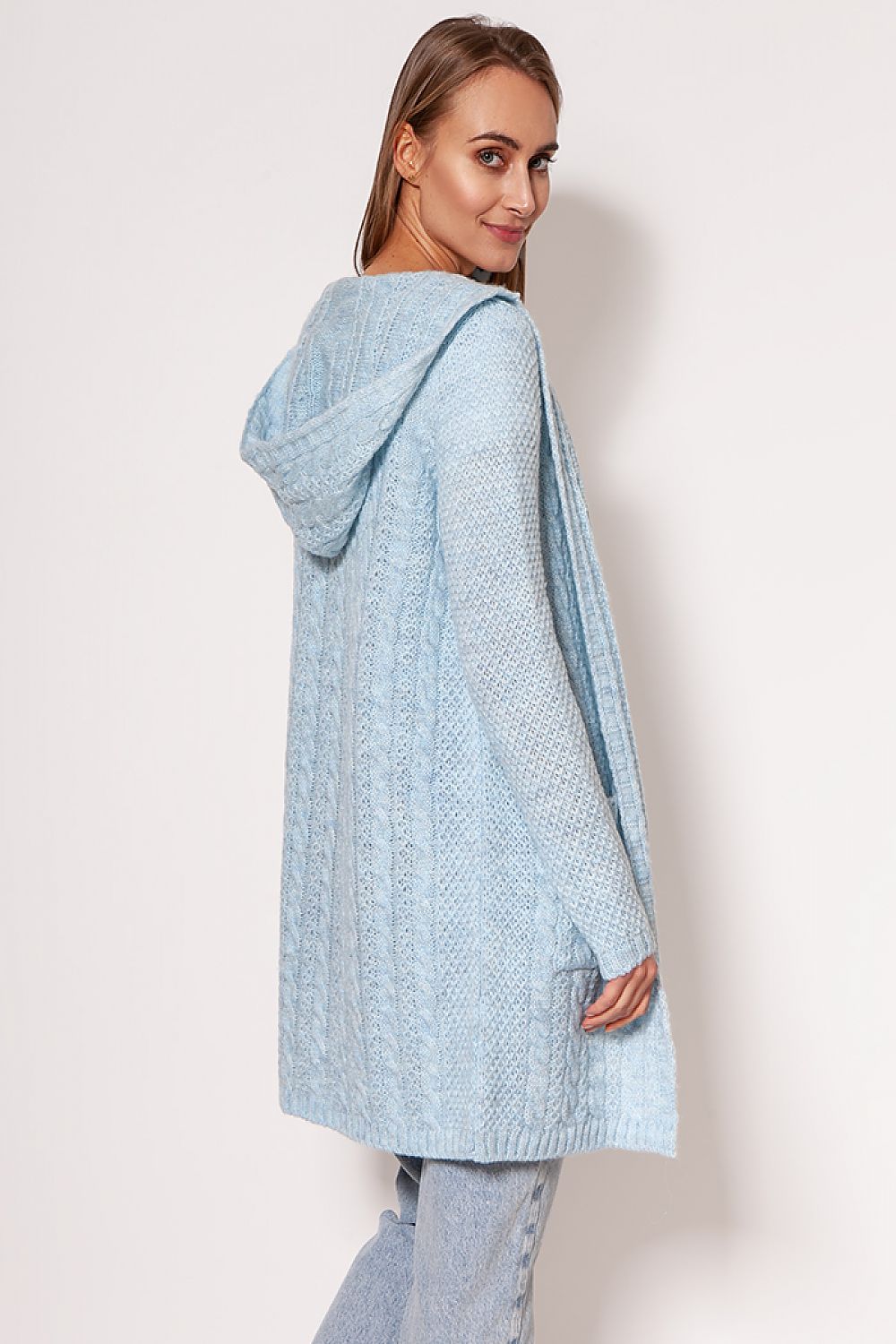 Luxurious MKM soft cardigan coat in light blue, featuring a minimalist design, dropped shoulders, and hip pockets, exhibited by a model showcasing a casual yet chic style.