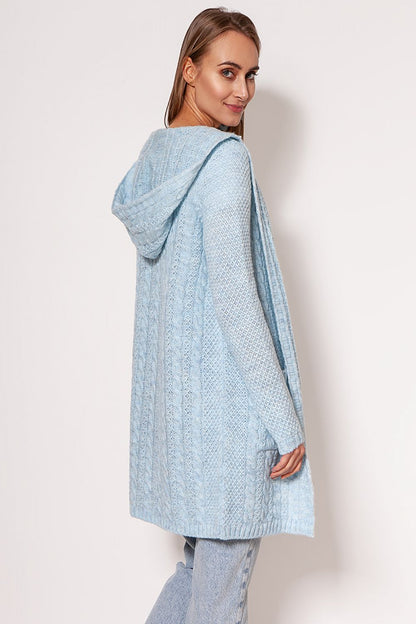 Luxurious MKM soft cardigan coat in light blue, featuring a minimalist design, dropped shoulders, and hip pockets, exhibited by a model showcasing a casual yet chic style.